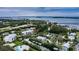 Panoramic aerial view showcasing waterfront condos with boat docks and a picturesque coastal landscape at 4212 126Th W St # 401, Cortez, FL 34215