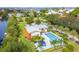 Backyard featuring a private pool, lush landscaping, and a wooden deck perfect for outdoor entertaining at 4212 126Th W St # 401, Cortez, FL 34215