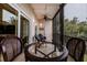 Comfortable screened balcony featuring elegant seating with tranquil views at 4212 126Th W St # 401, Cortez, FL 34215