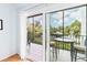 Relaxing balcony with seating, offering views of lush greenery and waterway at 4212 126Th W St # 401, Cortez, FL 34215
