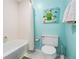 Bathroom with art and white shower curtain at 4212 126Th W St # 401, Cortez, FL 34215