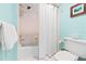 Bathroom with white tile, toilet, and bathtub with shower curtain at 4212 126Th W St # 401, Cortez, FL 34215