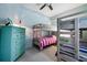 Bright bedroom with light blue walls and two sets of wooden bunk beds at 4212 126Th W St # 401, Cortez, FL 34215