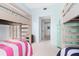 Bright bedroom with light blue walls and two sets of wooden bunk beds at 4212 126Th W St # 401, Cortez, FL 34215