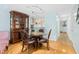 Dining area features a glass table and a built-in china cabinet at 4212 126Th W St # 401, Cortez, FL 34215