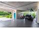 Spacious garage featuring a golf cart, car, and ample storage space, offering convenience and functionality at 4212 126Th W St # 401, Cortez, FL 34215