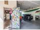 Garage with a sticker-covered door, storage, car, and kayak, offering both functionality and personality at 4212 126Th W St # 401, Cortez, FL 34215