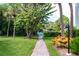 Scenic walk way to the pool area surrounded by vibrant landscaping at 4212 126Th W St # 401, Cortez, FL 34215