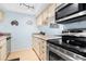 Charming kitchen with stainless steel appliances and stylish decor at 4212 126Th W St # 401, Cortez, FL 34215