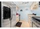 Galley kitchen featuring stainless steel appliances and bright, neutral finishes at 4212 126Th W St # 401, Cortez, FL 34215