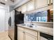 Well-equipped kitchen with stainless steel appliances and a convenient layout at 4212 126Th W St # 401, Cortez, FL 34215
