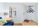 Bright living area with coastal decor, plantation shutters, and tile flooring at 4212 126Th W St # 401, Cortez, FL 34215