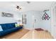 Cozy living area features a futon, neutral tile flooring, and coastal accents at 4212 126Th W St # 401, Cortez, FL 34215
