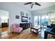 Inviting living room with balcony access, hardwood floors, and comfortable seating at 4212 126Th W St # 401, Cortez, FL 34215