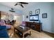 Comfortable living room with hardwood floors, ceiling fan, and wall-mounted TV at 4212 126Th W St # 401, Cortez, FL 34215