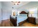 Spacious main bedroom features hardwood floors, a queen bed and ample natural light at 4212 126Th W St # 401, Cortez, FL 34215