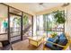 Relaxing screened porch features comfortable seating, and bright sunlight at 4212 126Th W St # 401, Cortez, FL 34215
