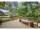 Spacious deck with lush landscaping and seating at 4421 W Sevilla St, Tampa, FL 33629