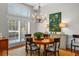 Elegant dining room with hardwood floors, a large table, and a beautiful chandelier at 4421 W Sevilla St, Tampa, FL 33629