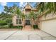 Front entrance of brick home with palm trees at 4421 W Sevilla St, Tampa, FL 33629