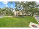 Large home on corner lot with lush green lawn at 4421 W Sevilla St, Tampa, FL 33629