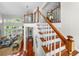 View of a grand staircase with wooden railings and hardwood floors at 4421 W Sevilla St, Tampa, FL 33629