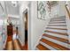 Elegant wooden staircase with hardwood floors at 4421 W Sevilla St, Tampa, FL 33629