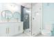 Updated bathroom with white cabinets, quartz countertops, and a glass shower at 4643 Bay Crest Dr, Tampa, FL 33615