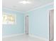 Bedroom with light blue walls and access to bathroom at 4643 Bay Crest Dr, Tampa, FL 33615