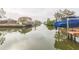 Scenic view of a peaceful canal with boats and waterfront homes at 4643 Bay Crest Dr, Tampa, FL 33615