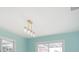 Dining area with light blue walls and modern light fixture at 4643 Bay Crest Dr, Tampa, FL 33615