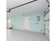 Attached garage with light blue walls and an automatic door at 4643 Bay Crest Dr, Tampa, FL 33615