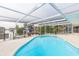 Inviting kidney-shaped pool with a screened enclosure at 4643 Bay Crest Dr, Tampa, FL 33615