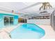 Inviting kidney-shaped pool with a screened enclosure at 4643 Bay Crest Dr, Tampa, FL 33615