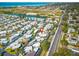 Aerial view of a waterfront community with well-maintained streets and homes near a picturesque bay area at 4851 W Gandy Blvd # B2L25, Tampa, FL 33611