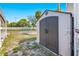 Exterior shot of storage shed in backyard with grassy lawn under blue skies at 4851 W Gandy Blvd # B2L25, Tampa, FL 33611