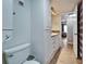 Bathroom featuring updated cabinetry, a tile backsplash, and a toilet with an elongated bowl at 4917 Puritan Cir, Tampa, FL 33617