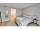 Serene bedroom with wood floors offering a mirror and access to the ensuite bathroom at 4917 Puritan Cir, Tampa, FL 33617