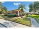 View of community clubhouse with a fenced pool area at 4917 Puritan Cir, Tampa, FL 33617