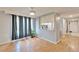 Open-concept dining area featuring hardwood floors and abundant natural light flowing into the adjacent kitchen at 4917 Puritan Cir, Tampa, FL 33617