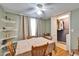 Cozy dining room with ample seating, floating shelves, and a walk-in laundry closet at 4917 Puritan Cir, Tampa, FL 33617