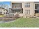 Exterior view of the condo featuring a screened lanai and well-maintained grounds at 4917 Puritan Cir, Tampa, FL 33617