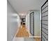 Inviting hallway showcasing hardwood floors and neutral paint, leading to various living areas and bedrooms at 4917 Puritan Cir, Tampa, FL 33617