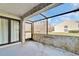 View of the screened patio with sliding glass door and decorative molding at 4917 Puritan Cir, Tampa, FL 33617