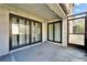 Patio with dark framed sliding glass doors at 4917 Puritan Cir, Tampa, FL 33617