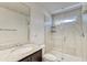 Bright bathroom featuring granite vanity, glass enclosed shower, and modern fixtures offering a luxurious and comfortable space at 4925 White Sanderling Ct, Tampa, FL 33619