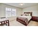 Bedroom has a queen bed, natural light and carpeted floor at 4925 White Sanderling Ct, Tampa, FL 33619