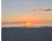 Beautiful sunset at the beach with calm waters at 50 Acacia St, Clearwater Beach, FL 33767