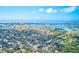 Aerial shot showcasing the city skyline near a neighborhood with mature trees at 5308 Ben Hur Dr, St Petersburg, FL 33708