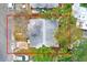 Overhead view of home with surrounding trees and nearby street at 5308 Ben Hur Dr, St Petersburg, FL 33708